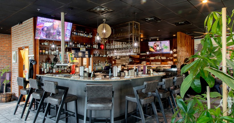 Bar with upholstered bar stools