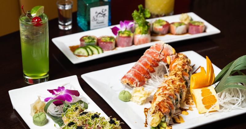 Various dishes served on the table with drinks