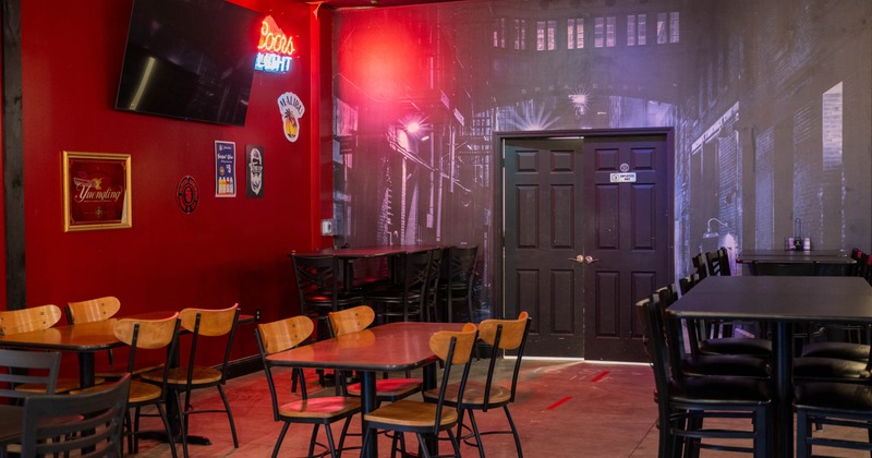 Interior, seating area, regular and high tables for four and six, decorative alley view wallpaper