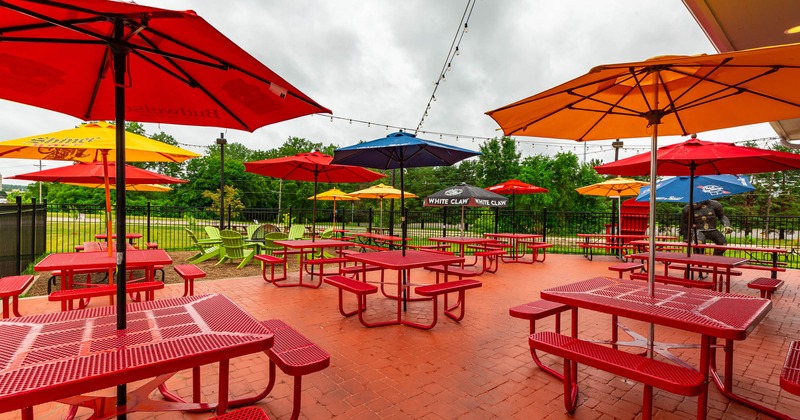 Exterior, patio tables and bench seats with parasols
