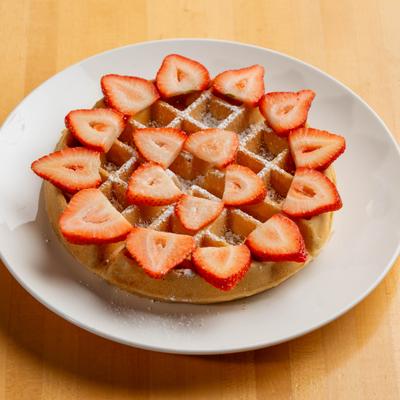 Strawberry Waffle topped with fresh strawberries and strawberry glaze.
