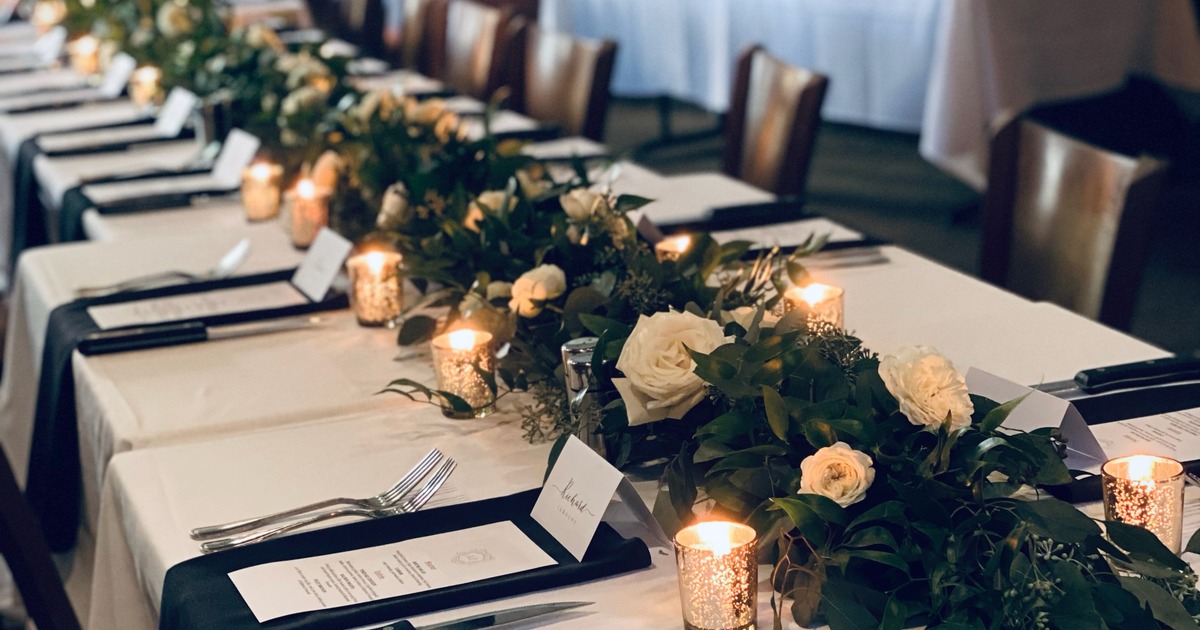 Dining tables with floral centerpieces
