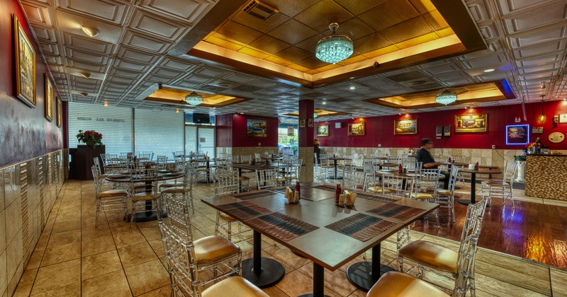 Interior, tables and chairs ready for guests