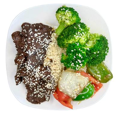 Sesame beef with broccoli, rice, and vegetables.