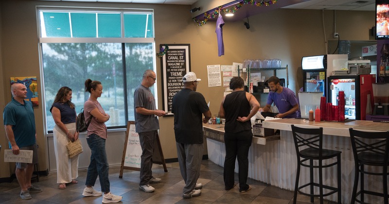 Interior, food counter, people in line