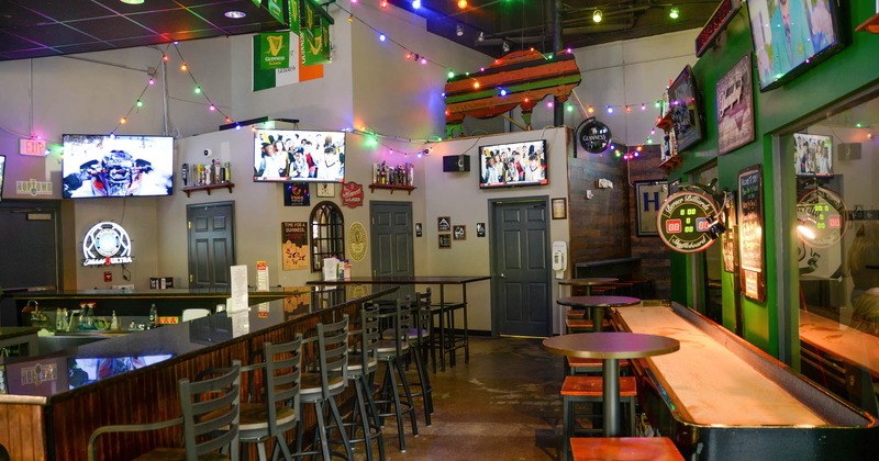 Interior, bar area and seating area, TVs on the walls
