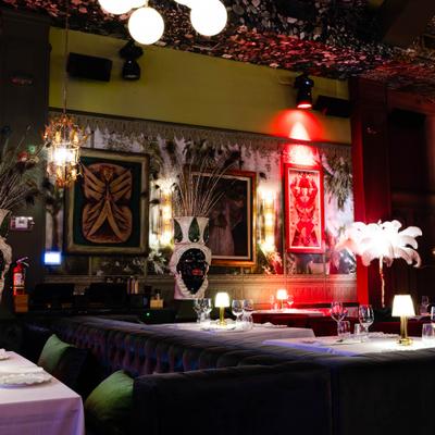 Interior hallway with artwork and lighting fixtures.