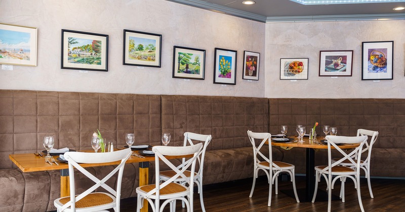 Interior, dining area, tables, chairs and seats, pictures on the wall