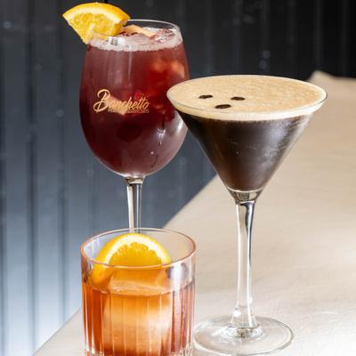 Sangria, Old Fashioned, and Espresso Martini on a counter.