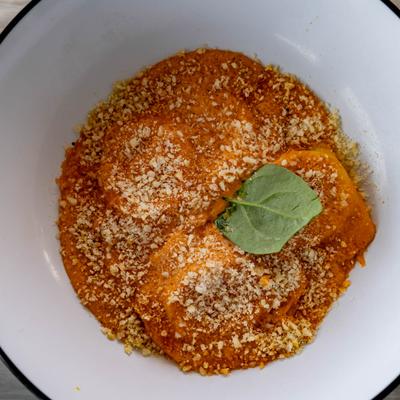 Burrata ravioli in vodka sauce, topped with toasted breadcrumbs and Parmesan.