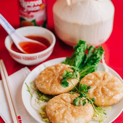 Pan fried rice cakes, stuffed with chive leaves.