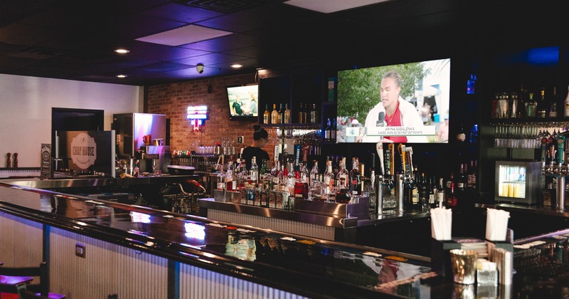 Bar, drinks rack, tv above