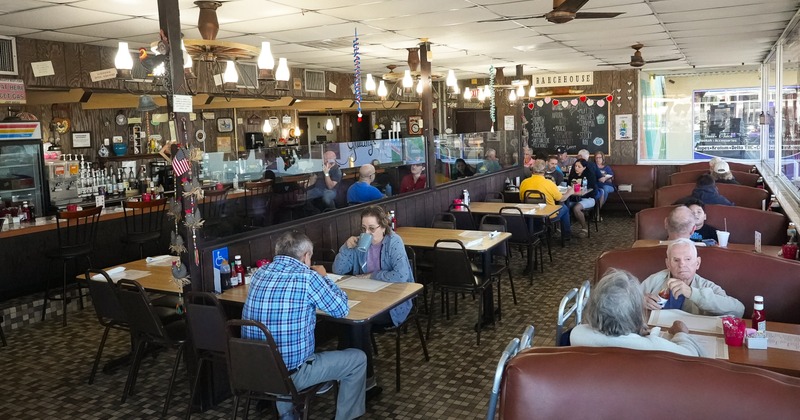 Interior, tables, benches, people