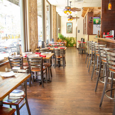 Interior, tables and chairs near large window