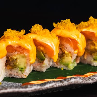 Shrimp tempura sushi rolls, with avocado, salmon, spicy mayo, and roe.
