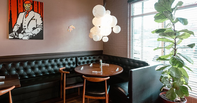 Interior, a booth with a round table and two chairs
