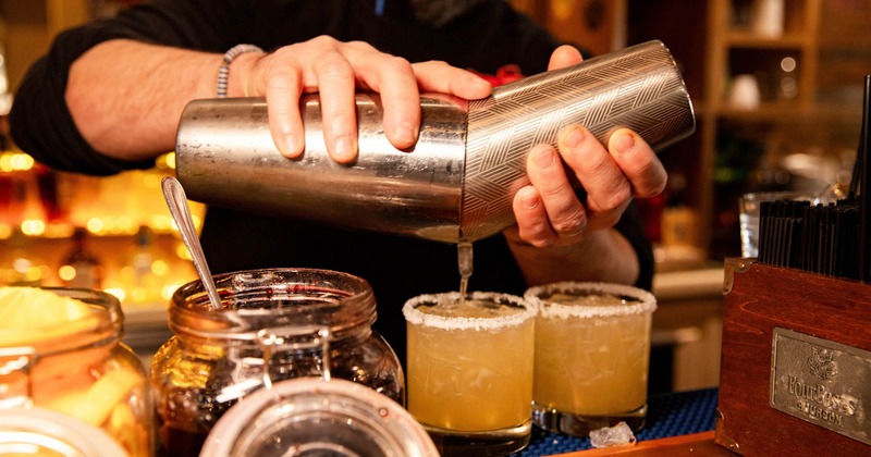 Bartender pouring cocktails