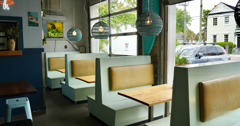Interior, booths with tables near the windows