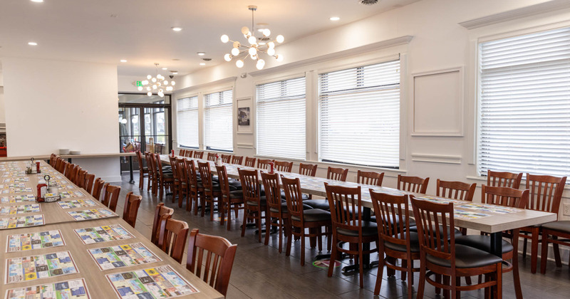 Interior, lots of tables and chairs, big windows