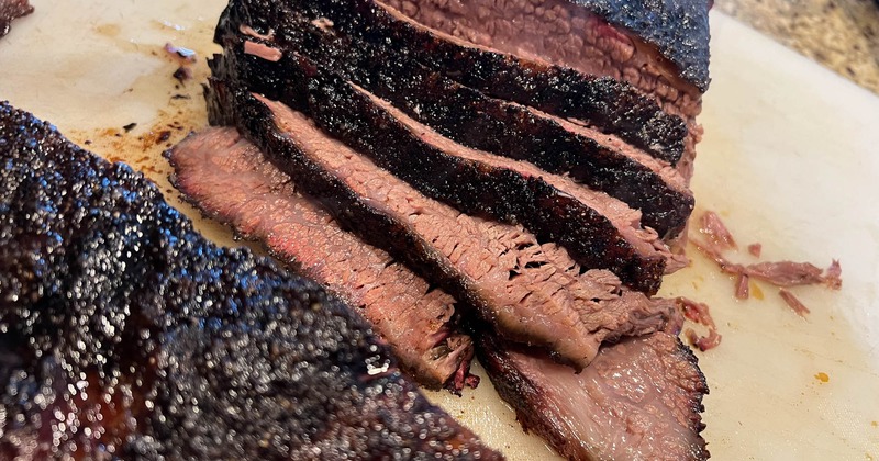 Smoked meat in slices on a slab