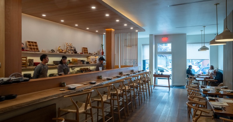 Interior, seating area  with few guests in the back
