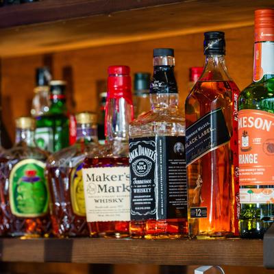Bottles of spirits on a shelf inside.