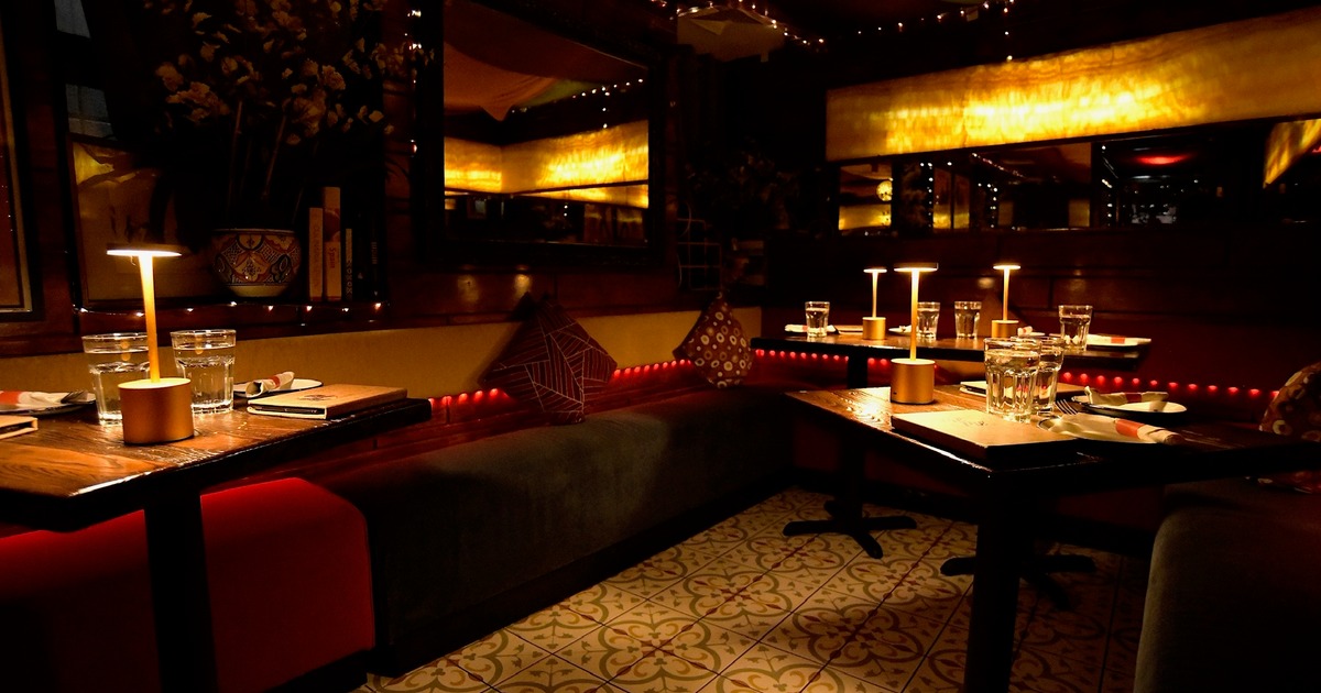 Warm lighting with separate tables and rustic decor