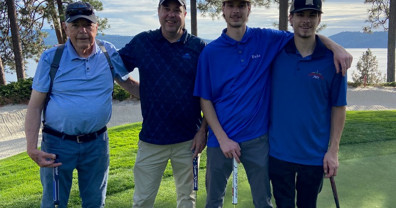 Golf players posing for a picture