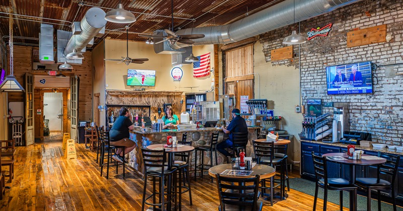 Interior, bar area, tables, stools, bar behind