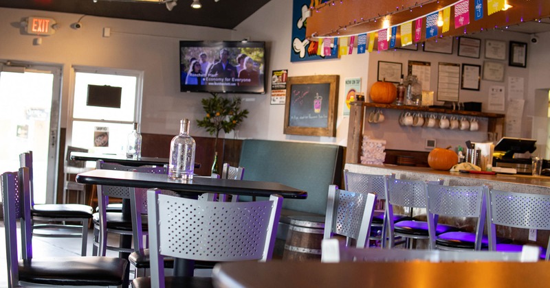 Interior, chairs, tables, counter, decorations, exit doors, wall TV