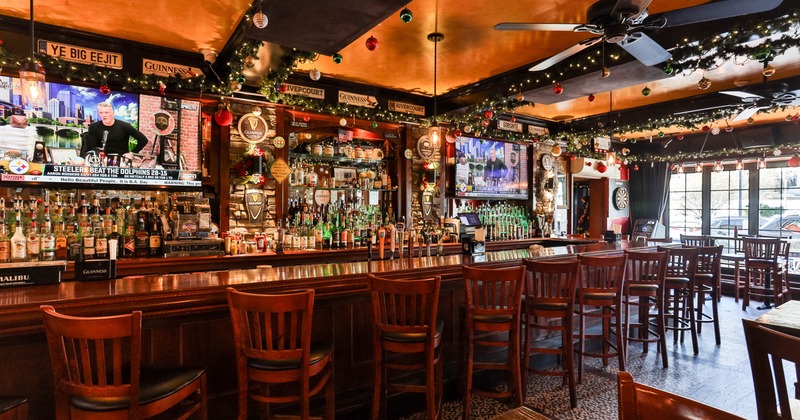 Bar area, neatly lined up bar stools