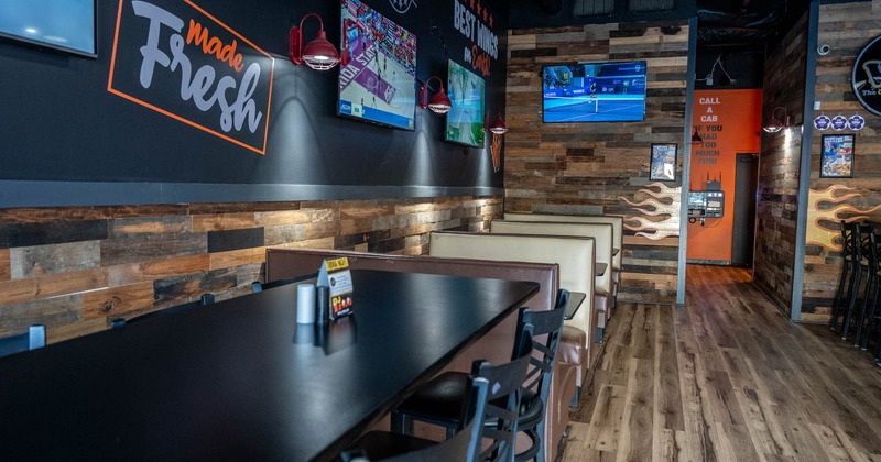 Interior, long table and booths in the back