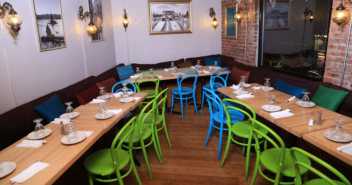 Cozy interior dining area with set tables perfect for private event