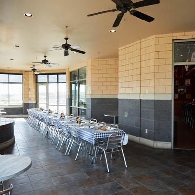 Interior, dining area, fully set tables lined up.