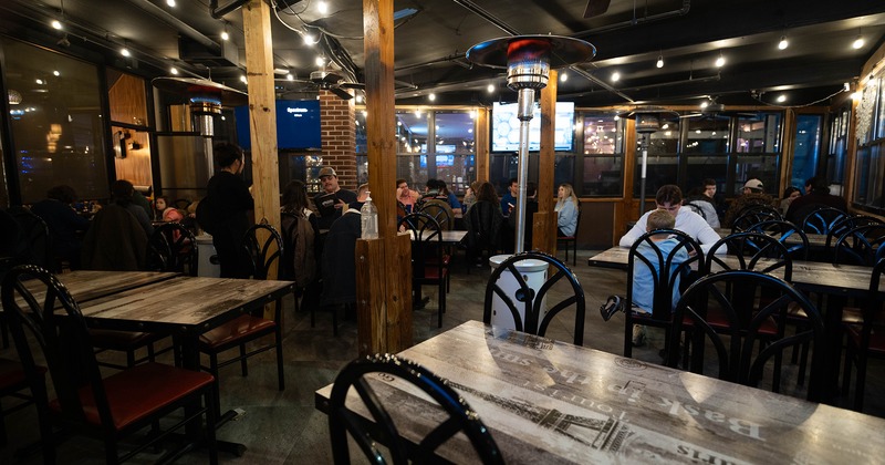 Covered patio dining area at night