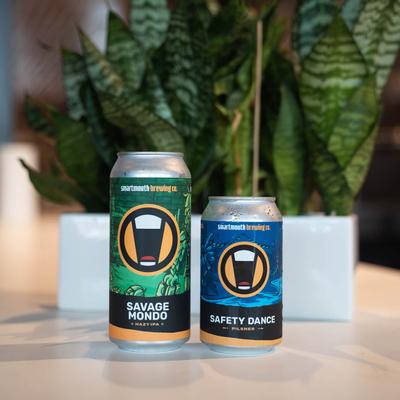 Cans of Savage Mondo Hazy IPA, and Safety Dance Pilsner.