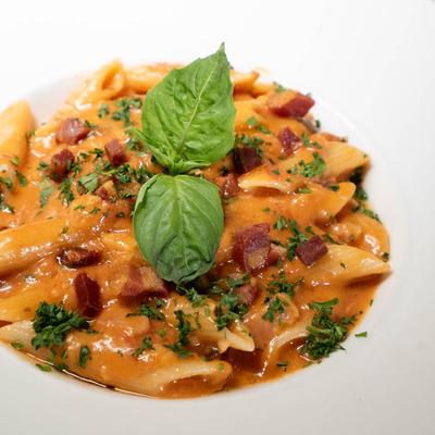 Penne alla vodka with pancetta and fresh basil.