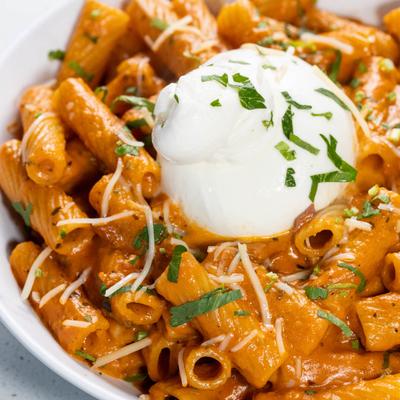 Rigatoni pasta with burrata cheese.