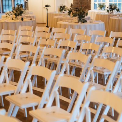 Interior, white chairs at wedding room.