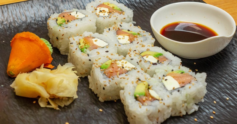 Sushi rolls with salmon, avocado, and cream cheese