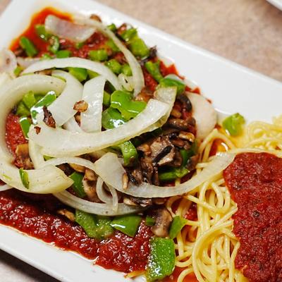 Baked chicken breast with sauteed peppers, mushrooms, onions, and thin spaghetti.