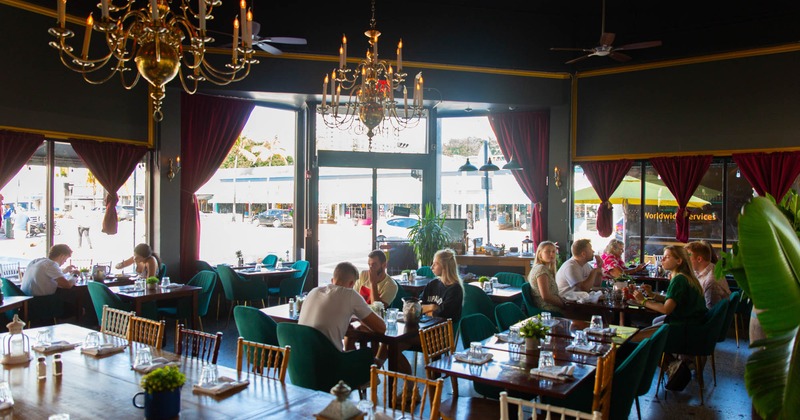 Interior, customers enjoying food and drinks in a dining area