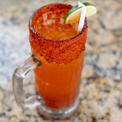 Red michelada beverage.