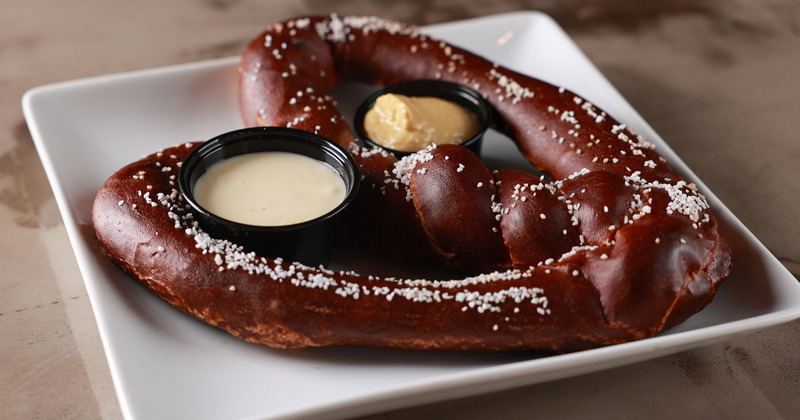 Pretzel served with dip