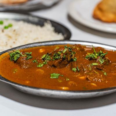 Lamb curry garnished with cilantro.