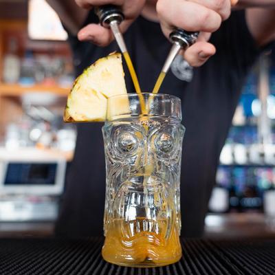 Mexican Mai Tai in a tiki glass with pineapple wedge, prepping.