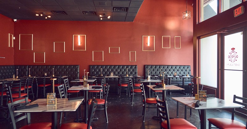 Interior, dining area, banquette benches with marble top tables and chairs