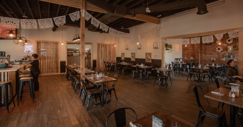 Interior, tables and chairs in dining area