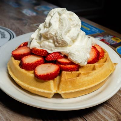 Belgian Waffle, with strawberries and whipped cream.