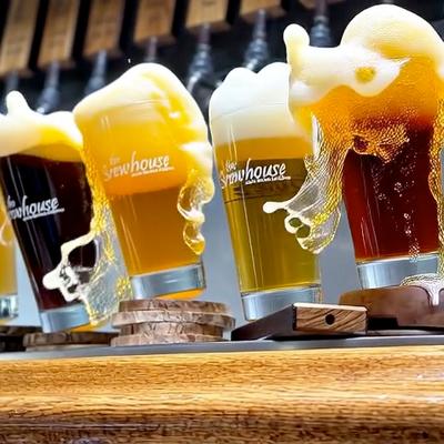 Beers rocking and spilling  at the bar.